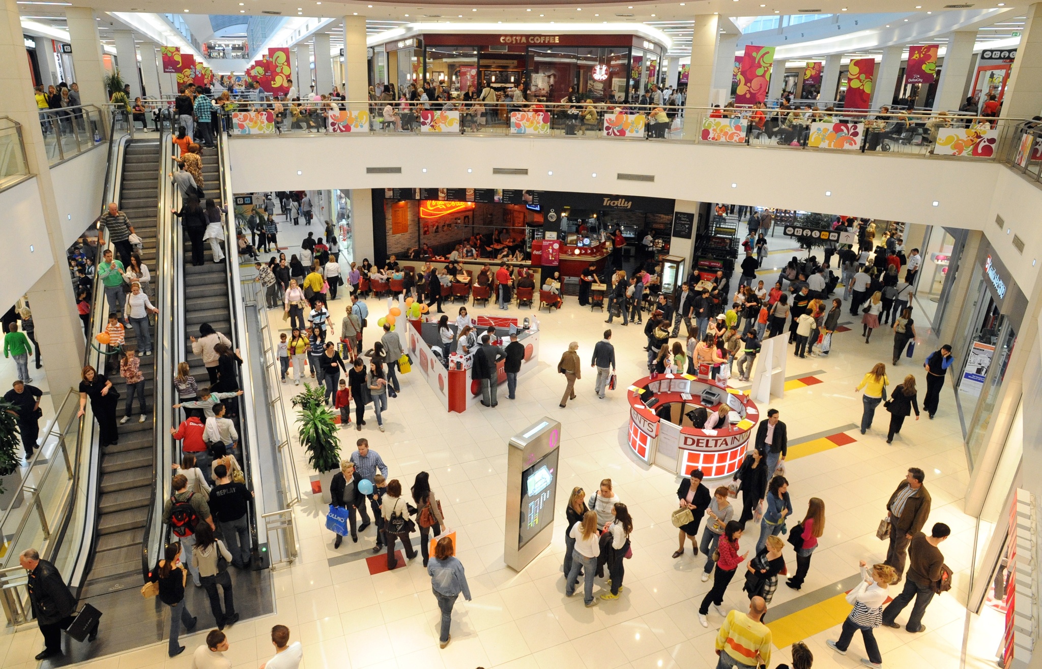 Shoppers in an indoor shopping mall's atrium