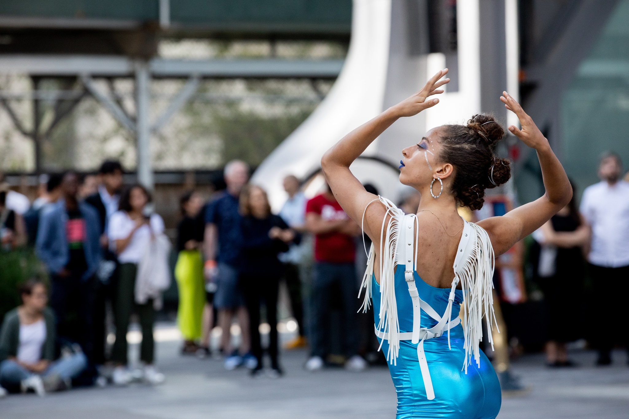 Dancer in motion on an outdoor stage.