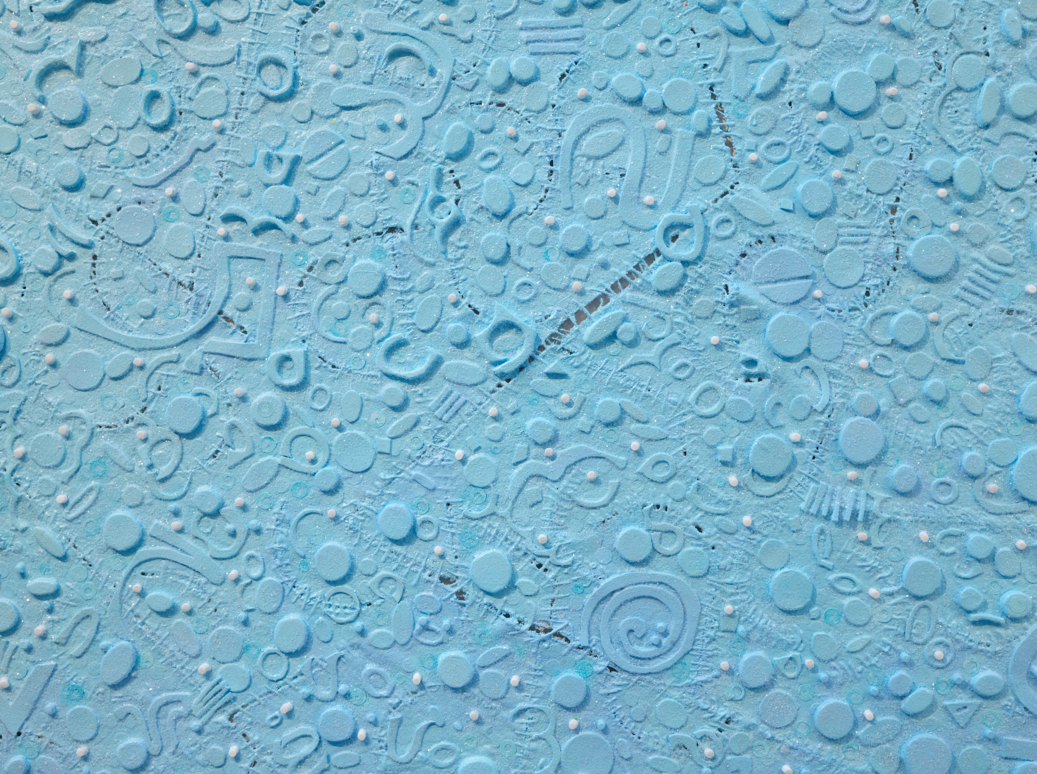 A square blue abstract canvas with elements added to its surface to resemble microscopic creatures seen beneath a microscope