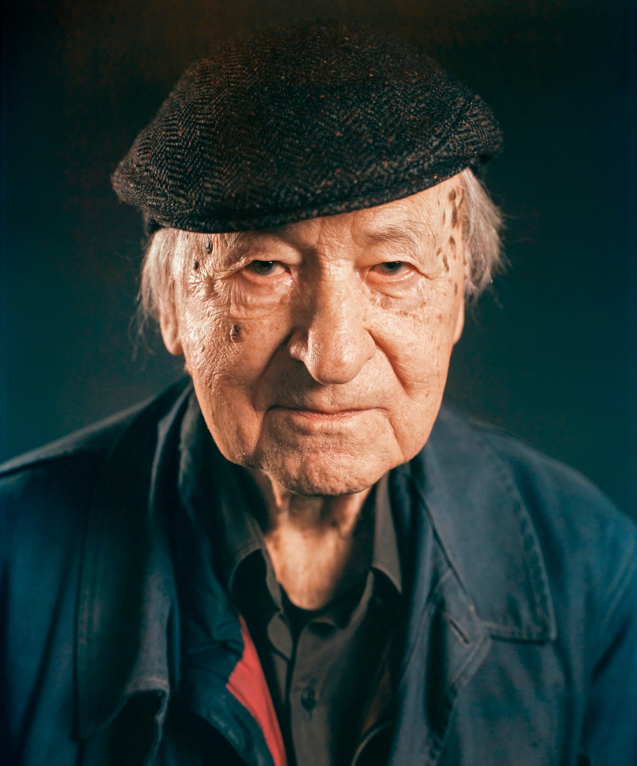 A photo portrait of the artist and filmmaker Jonas Mekas by Chuck Close